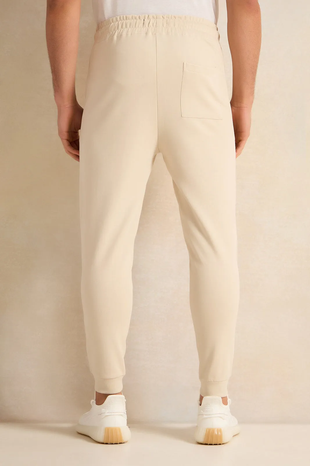 Men Beige Pleated Interlock Lounge Active Pants