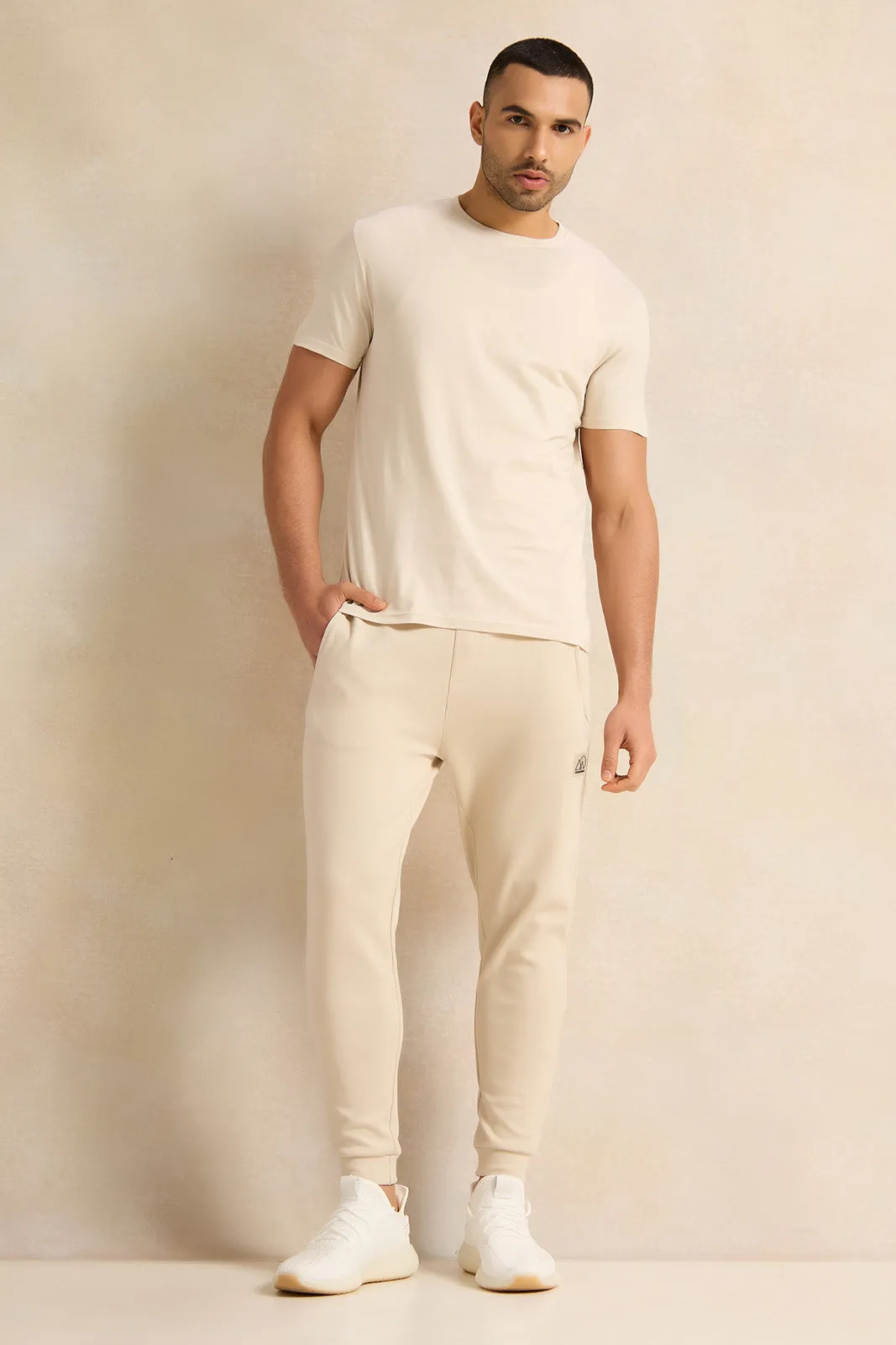 Men Beige Pleated Interlock Lounge Active Pants